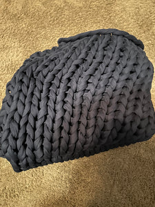 Chunky knit blanket folded up