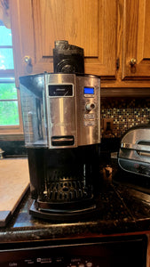 Coffee maker pulled forward on the caddy, making it more accessible.