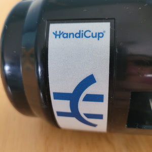 Close-up of the logo on the black HandiCup, which is blue, which a white background and beside it says HandiCup.