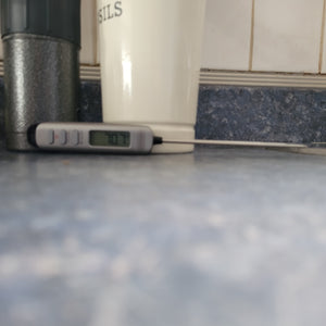 Countertop view of full meat thermometer. 70.7 F is visible on screen.
