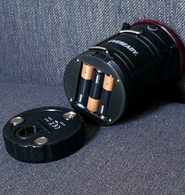 Load image into Gallery viewer, Battery compartment open on the bottom, showing three batteries.
