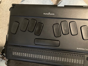 Black Humanware BrailleNoteTouch with 32 braille cells with cursor routing keys. 