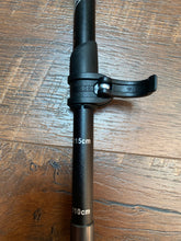 Load image into Gallery viewer, Close-up of heigh adjustment clip, which pulls back and then pushes back forward to set the height of the pole.
