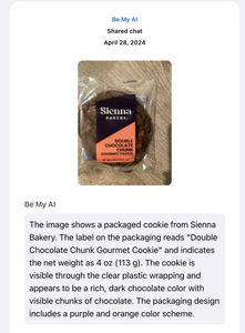 Be My AI says: "The image shows a packaged cookie from Sienna Bakery. The label on the packaging reads "Double Chocolate Chunk Gourmet Cookie" and indicates the net weight as 4 oz (113 g). The cookie is visible through the clear plastic wrapping and appears to be a rich, dark chocolate color with visible chunks of chocolate. The packaging design includes a purple and orange color scheme"