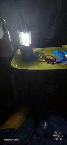 Karen uses the lantern on the tray of her walker during a power outage in January 2025