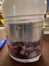 Load image into Gallery viewer, Side view of chopped onions through thee clear, base container.
