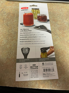 The back of the OXO Good Grips packaging, which says "Jar Opener with Base Pad" and highlights its various features and shows it in use. 
