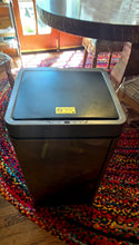 Load image into Gallery viewer, 16 gallon, gray, square-shaped motion sensor trash can by Hug&amp;Fkl. There is a small sensor visible on the edge of the trash can and a yellow label.
