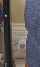 Load image into Gallery viewer, A white round plug has been inserted into a wall outlet. The lamp cord has been plugged into that, which allows for remote control.
