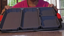 Load image into Gallery viewer, Close up of the four gray silicone baking pans on a cookie sheet. Two are larger and then the last two are small square pans.
