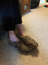 Load image into Gallery viewer, Side angle of shaggy leopard slippers on someone&#39;s feet
