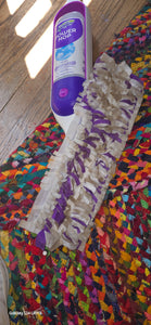 WetJet Power Mop Head, which has longer tassels of purple and white, and the purple solution cartridge