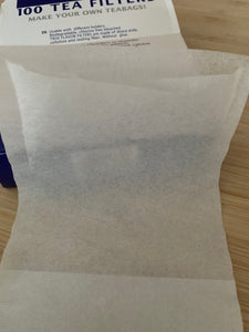 White paper tea bag with one end open