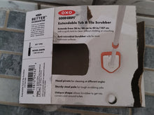 Load image into Gallery viewer, Back of the packaging with details about the length of the extender, the anti-microbial scrubber, pivoting head, steel pole, and unique shape. 

