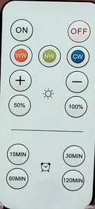 Close-up of the remote control for the light, which includes on, off, and other controls for the type of light (warm/cold), dimming, and setting a timer.