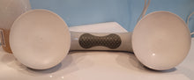 Load image into Gallery viewer, A view showing the bottom of the suction cup grab bar -- two white suction circles. The bottom of the handle of the grab bar is also visible, revealing a dark gray, textured grip.
