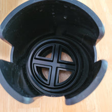 Load image into Gallery viewer, Another top-down view of the cup holder, showing three different slits in the sides, which create space for mug handles. 
