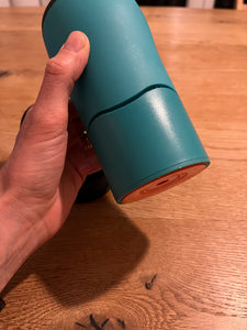 Side view of teal mug.