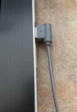 Load image into Gallery viewer, Gray 90 degree iPhone charging cable, plugged into the USB port of a laptop.
