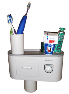 White toothbrush holder creates a small shelf on the wall. Cup sits on the shelf with three toothbrushes in it. On the other side of the shelf are Crest toothpaste (inserted into the toothpaste dispenser), another tube of toothpaste and deodorant. The toothbrush holder has a small drawer and a cup that is magnetized and hanging from the bottom of the shelf. 